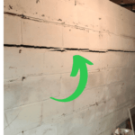 Arrow on wall pointing to foundation issue