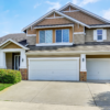 2 Story Suburban Home with manicured lawn