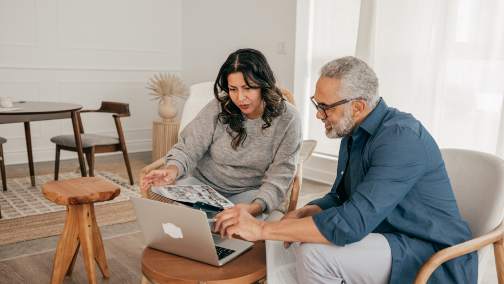Man and Women looking at laptop discussing foundation work
