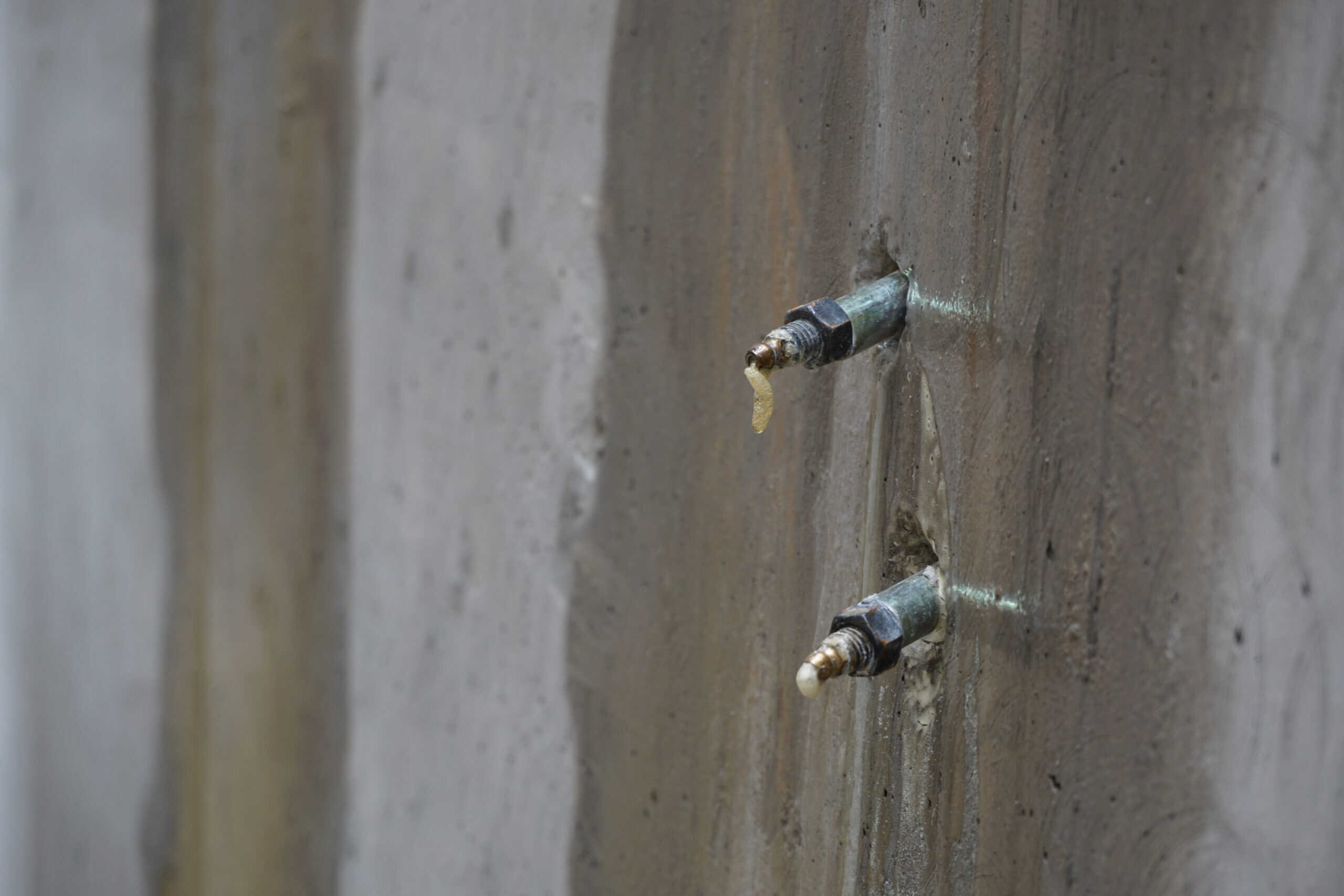 Close up of acrylate waterstop injection sealing a cold joint