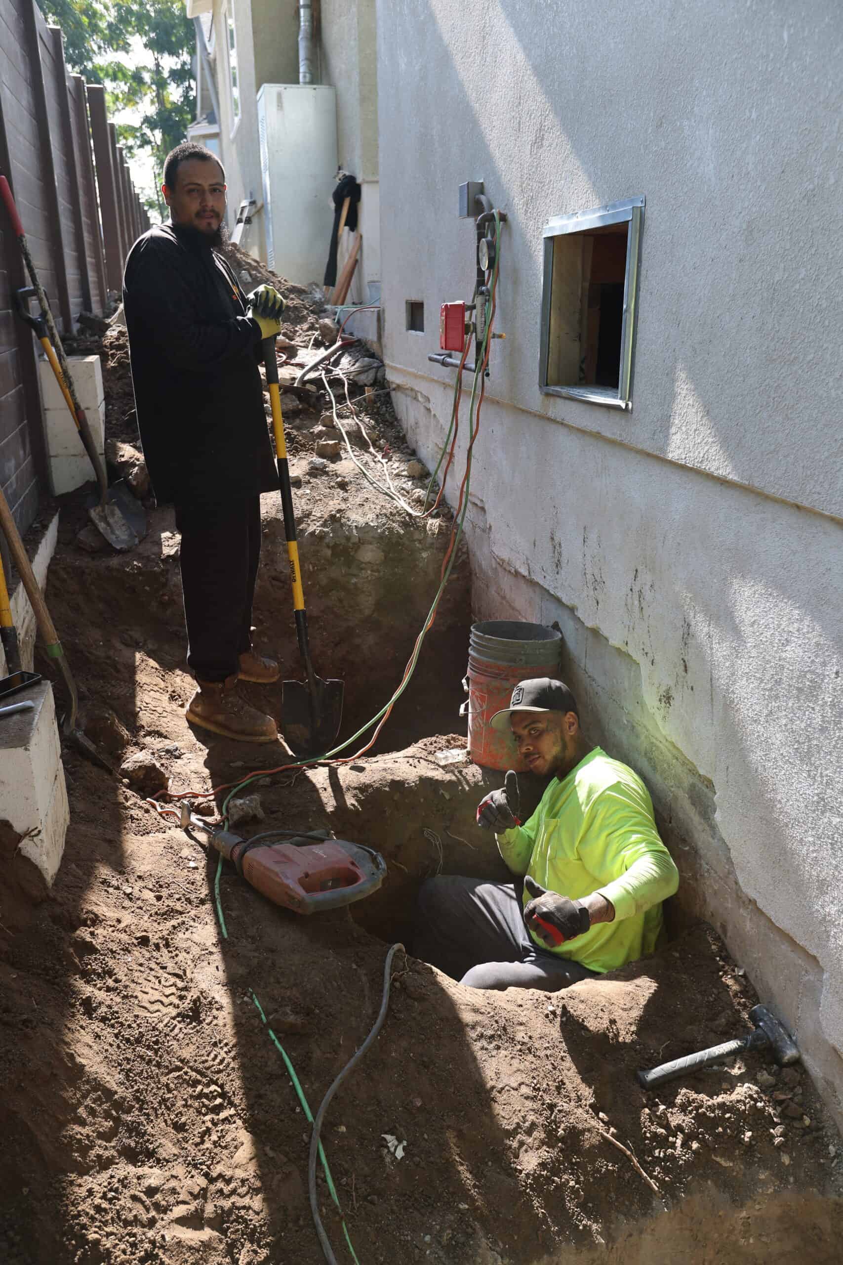 Excavating a deep footing for installation of ECP-300 push piers.