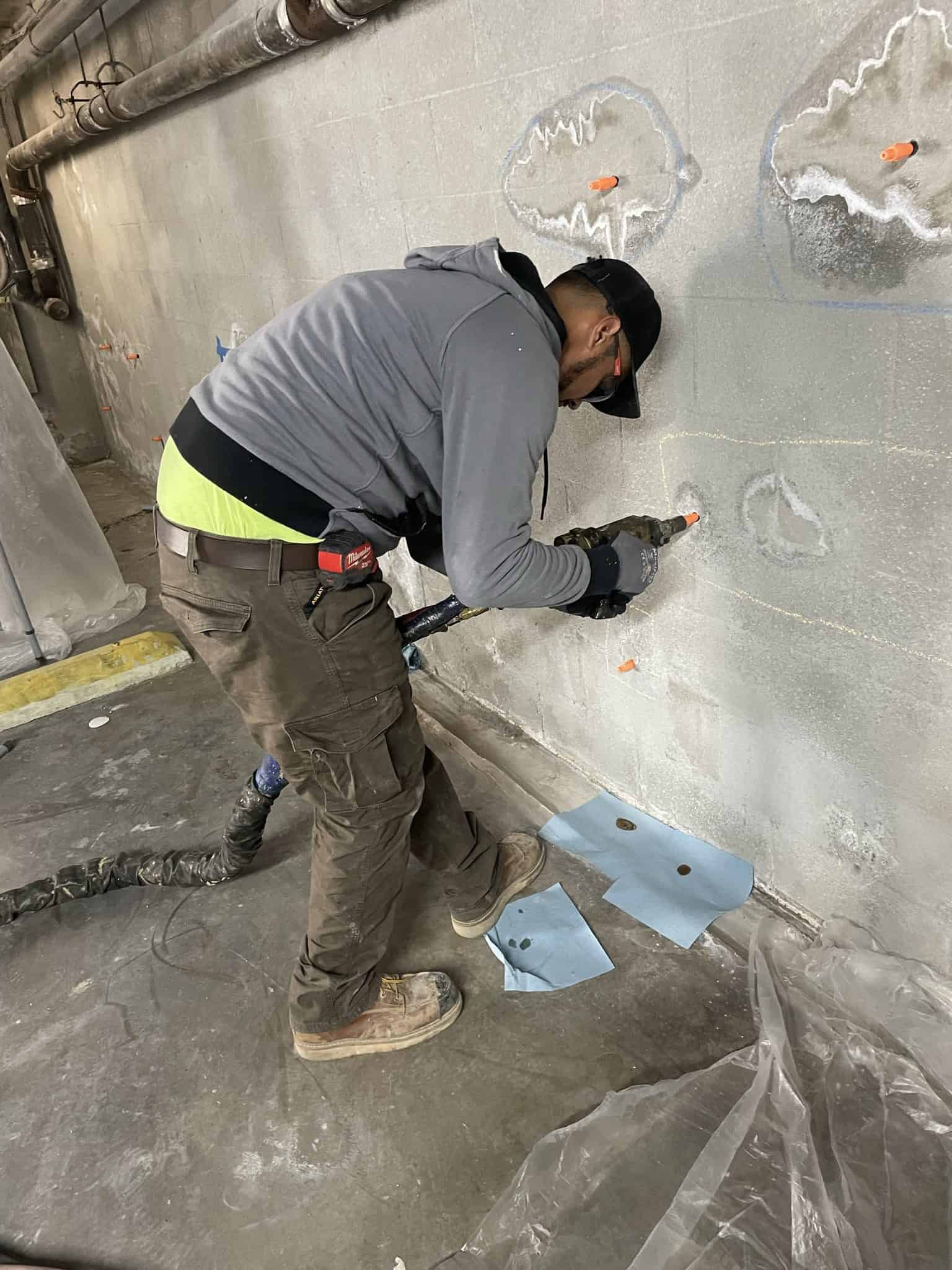 View of steep, triangular rooftops against a blue sky with clouds.