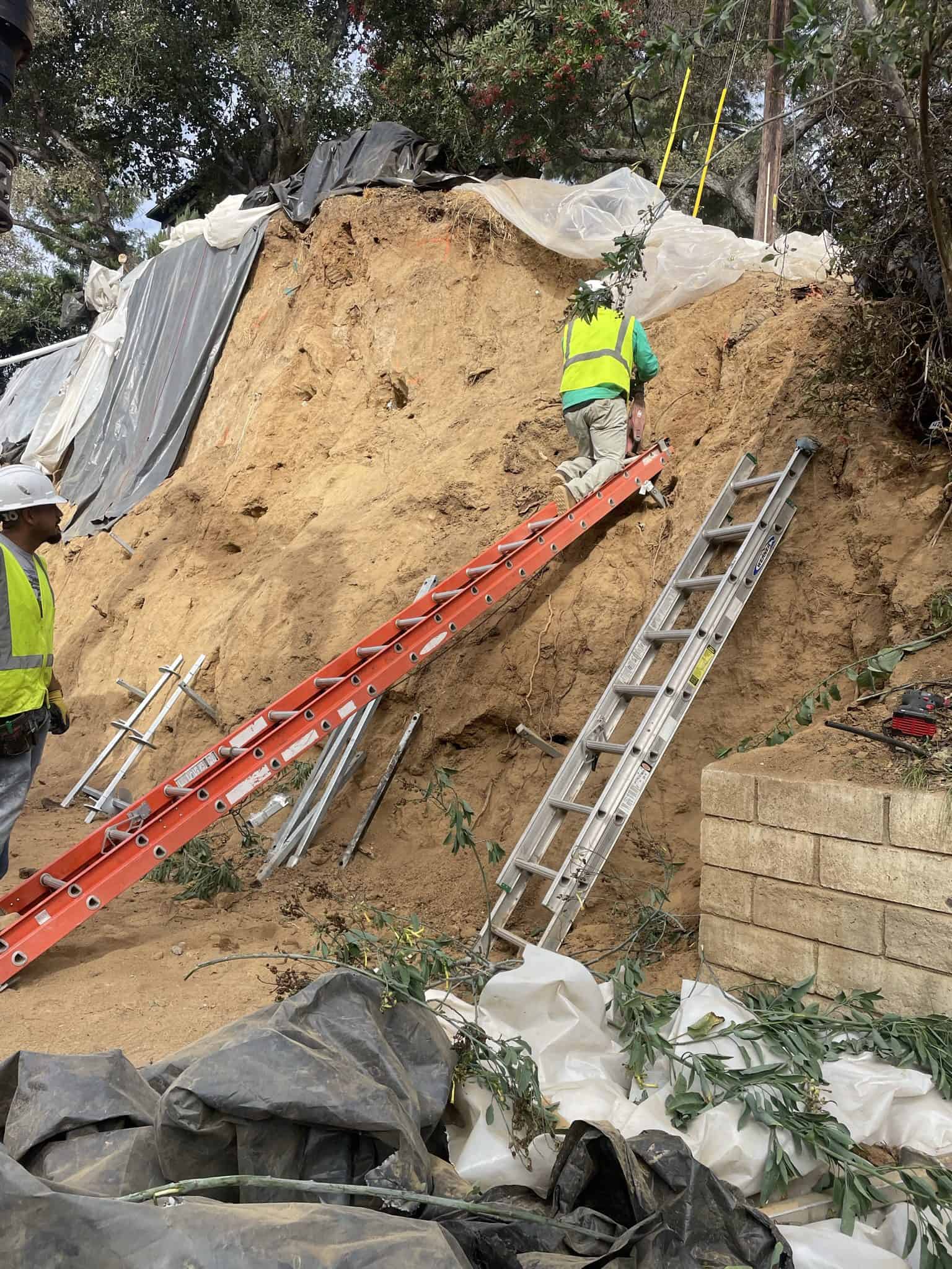 View of steep, triangular rooftops against a blue sky with clouds.