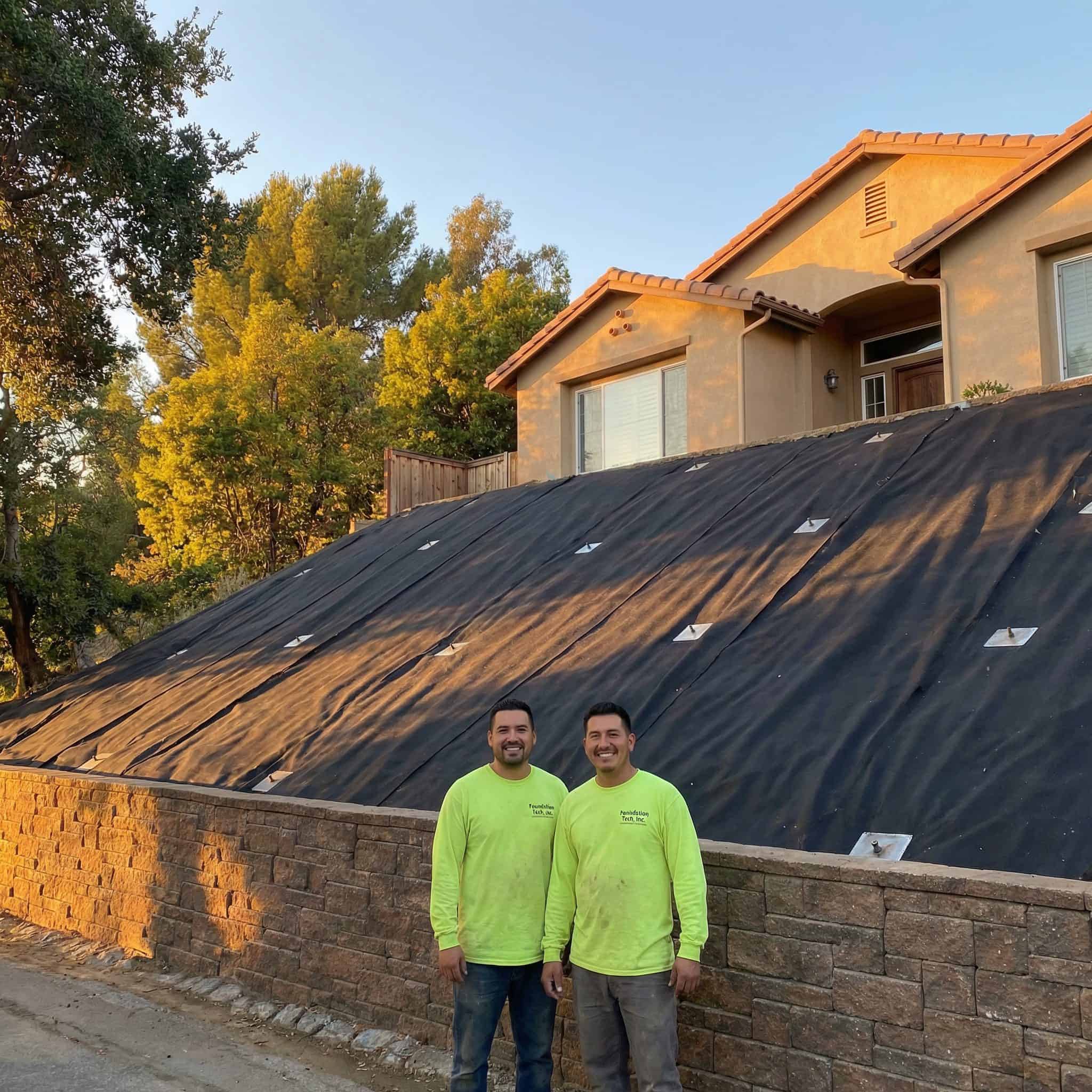 Bristol FX workers standing in front of a completed residential slope repair