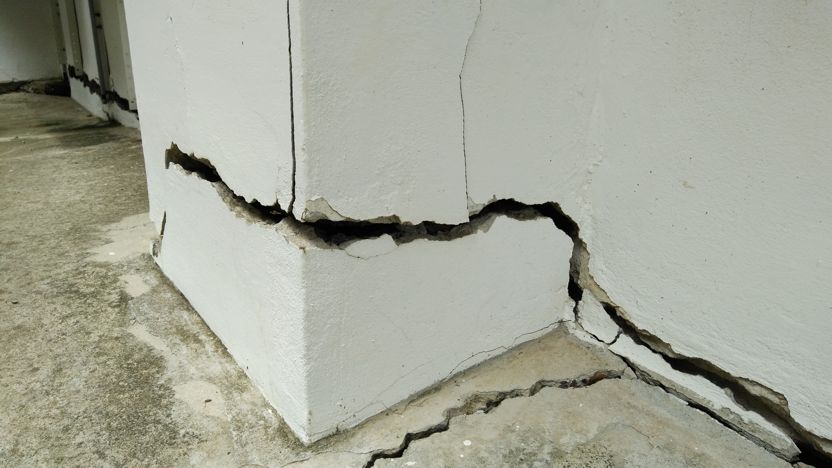 signs of foundation problems showing a cracked wall