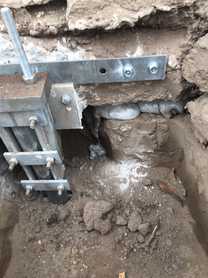 Push pier installed with 3 inch foundation lift and polyurethane foam fill in Bakersfield.