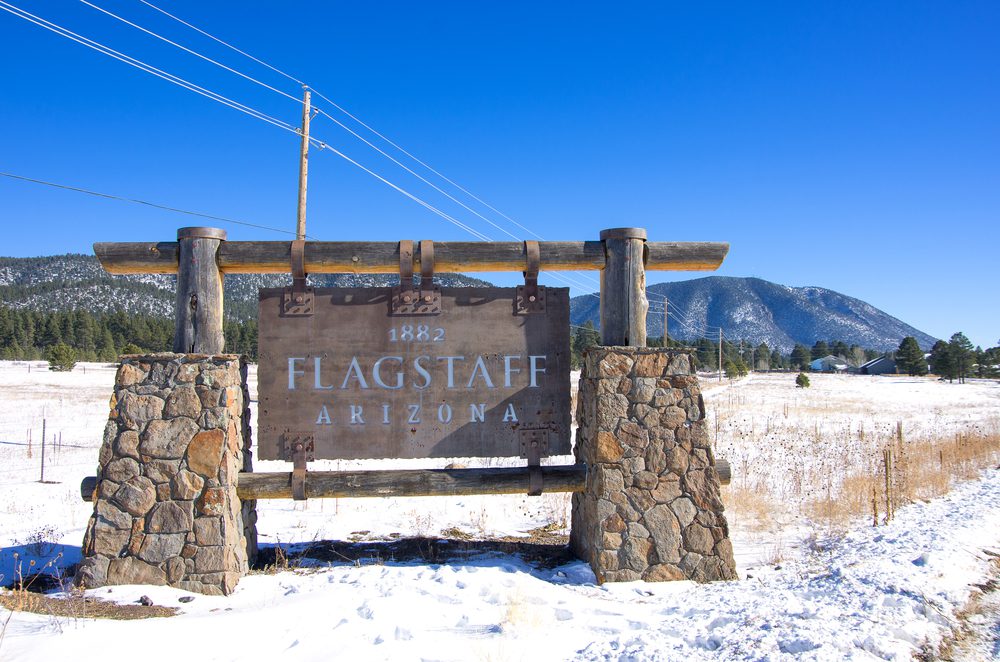 Snow-covered Welcome to Flagstaff Arizona city sign — Bristolfx Flagstaff foundation repair service area