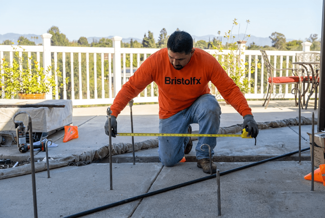 Bristolfx inspecting a cracked, settled concrete patio